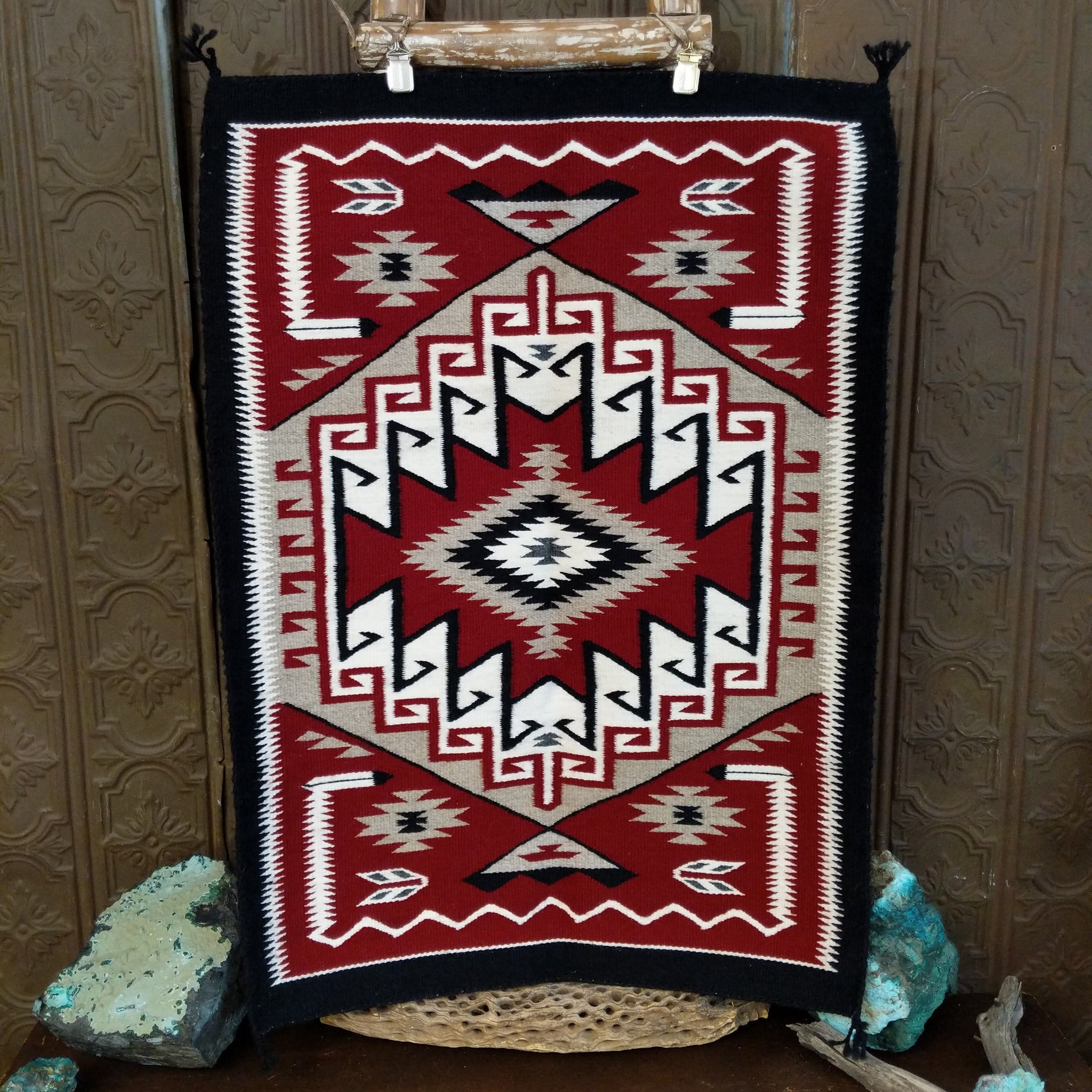 Klagetoh Navajo Rug shows a classic stepped diamond design in deep red, black, ivory, and gray