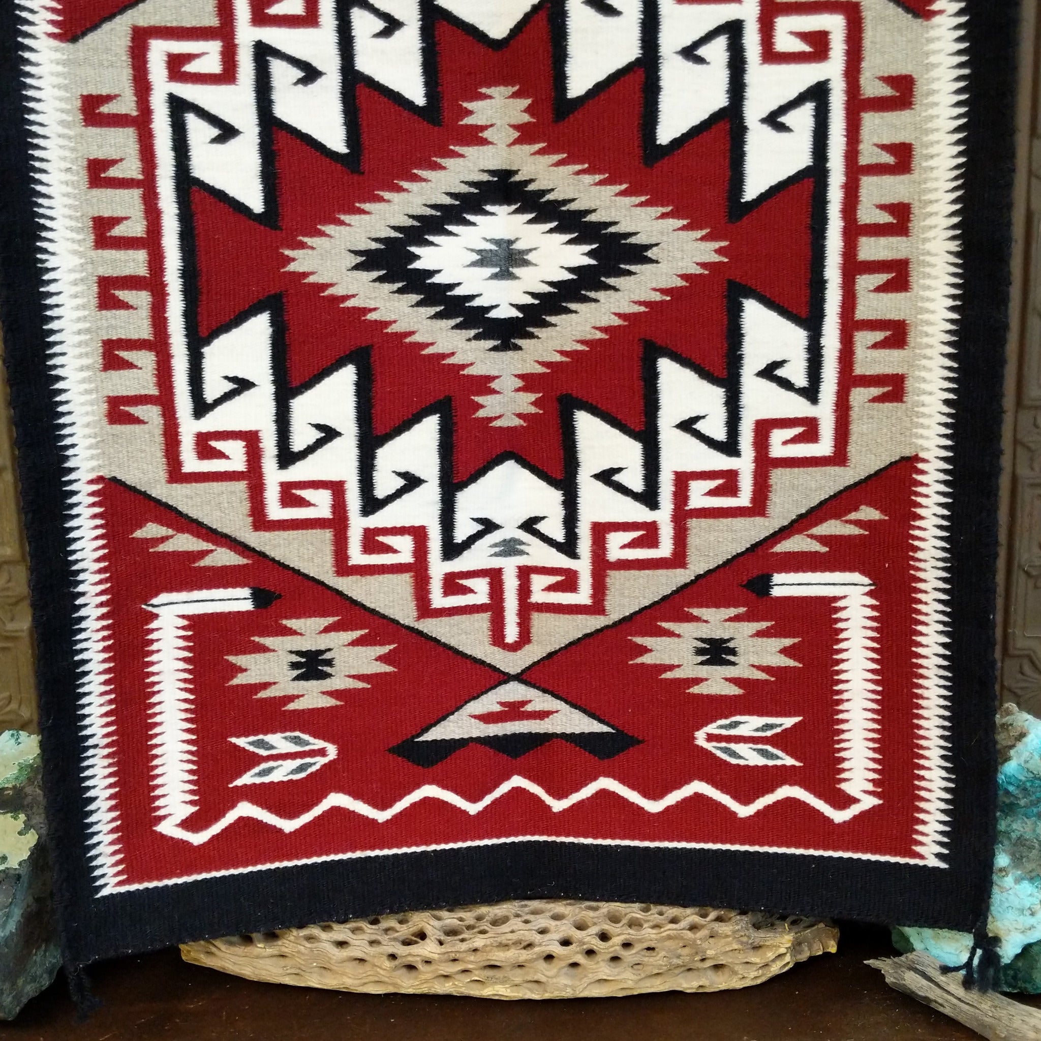 Klagetoh Navajo Rug shows a classic stepped diamond design in deep red, black, ivory, and gray