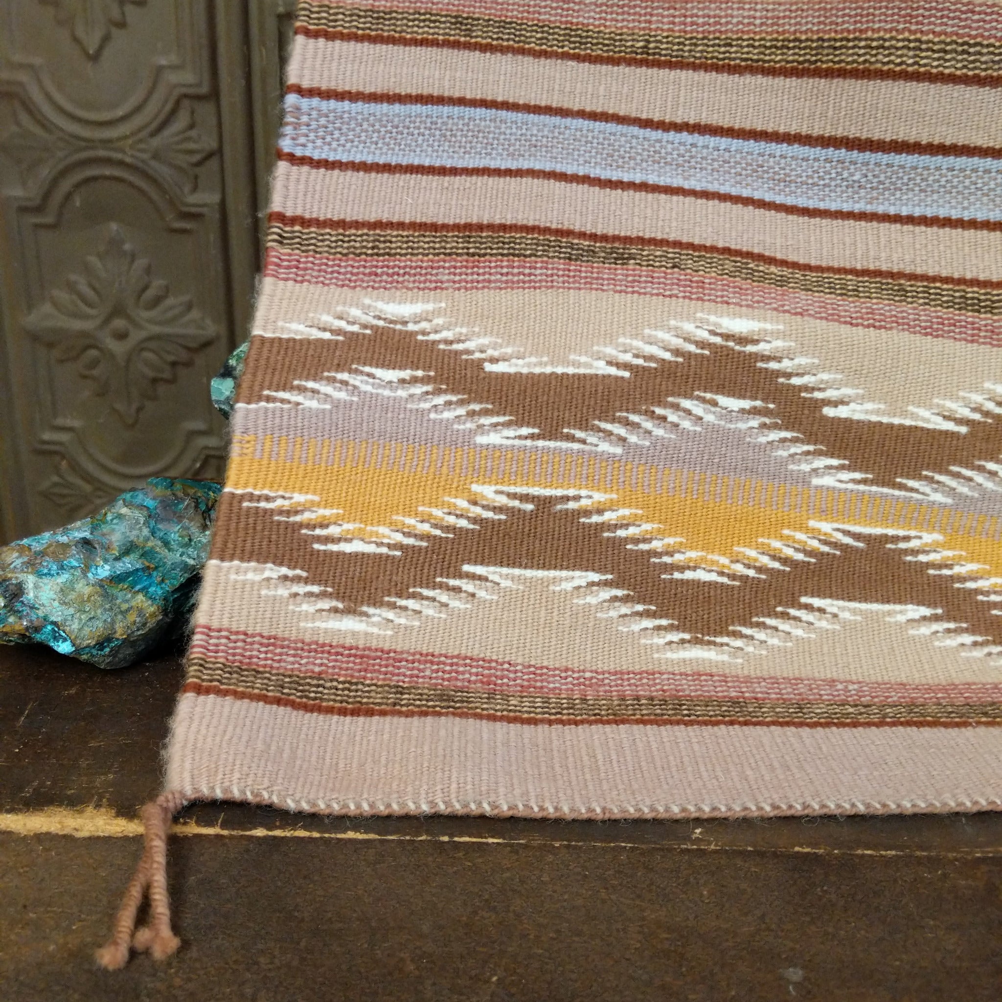 Wide Ruins Navajo Rug features alternating vertical stripes and elongated diamond motifs in soft earth tones 