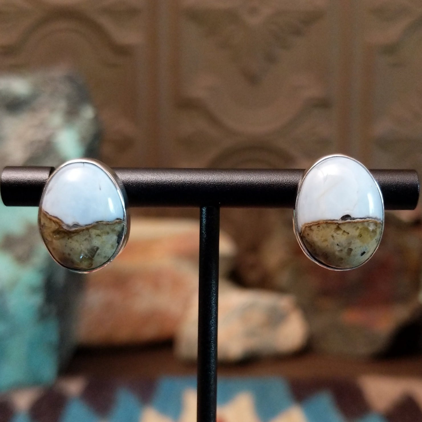 Sterling silver earrings with Arizona blue opal set in round bezels.