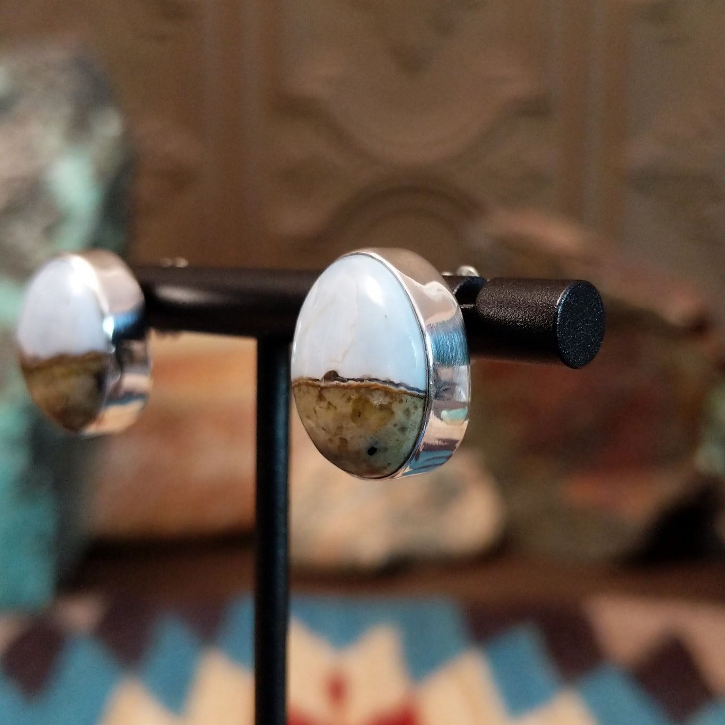 Sterling silver earrings with Arizona blue opal set in round bezels.
