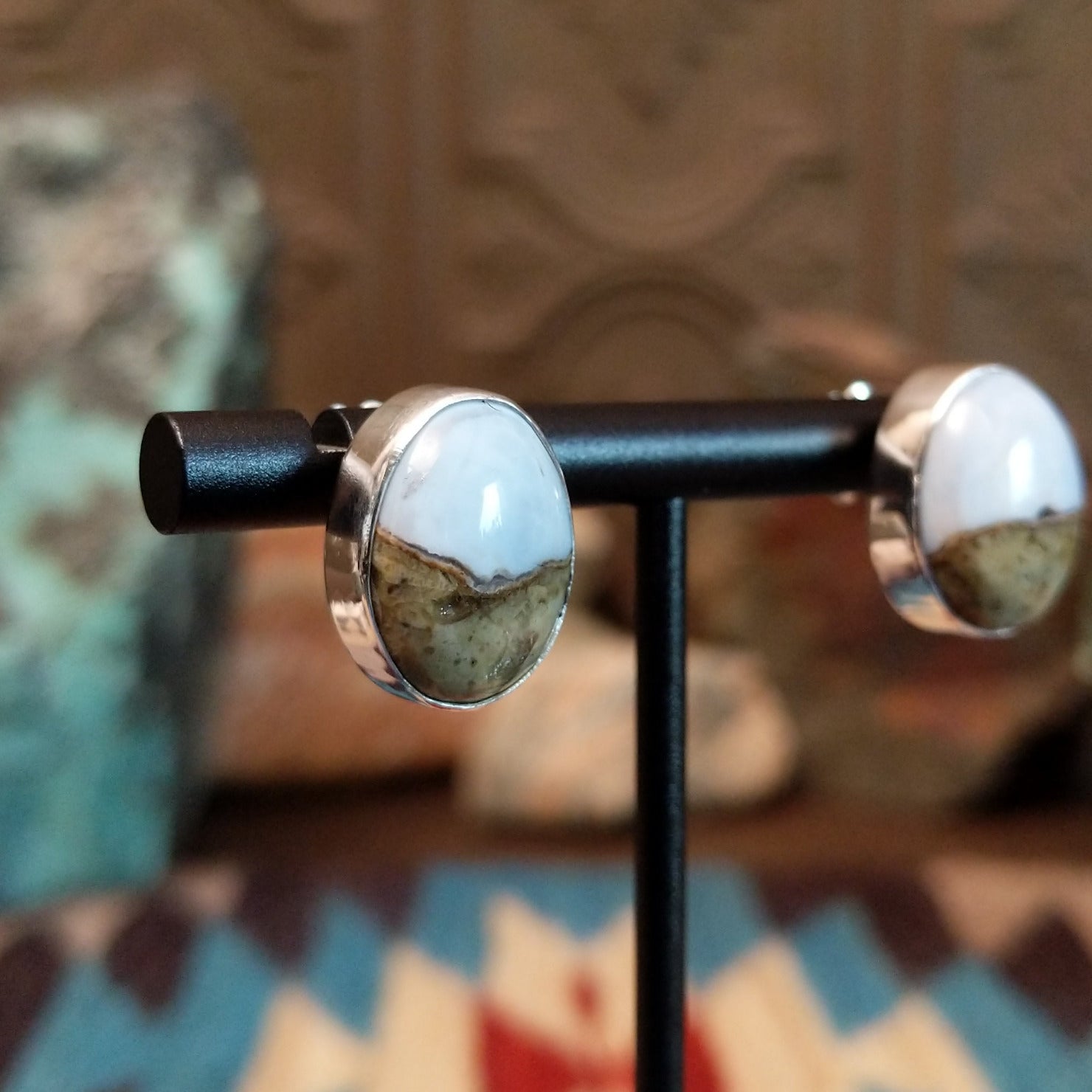 Sterling silver earrings with Arizona blue opal set in round bezels.
