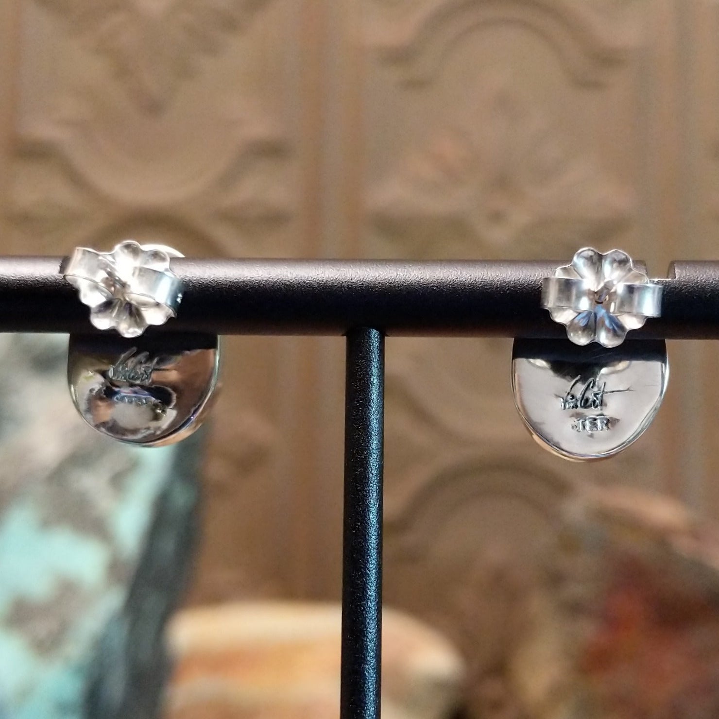 Close-up of the artisan's stamped signature.