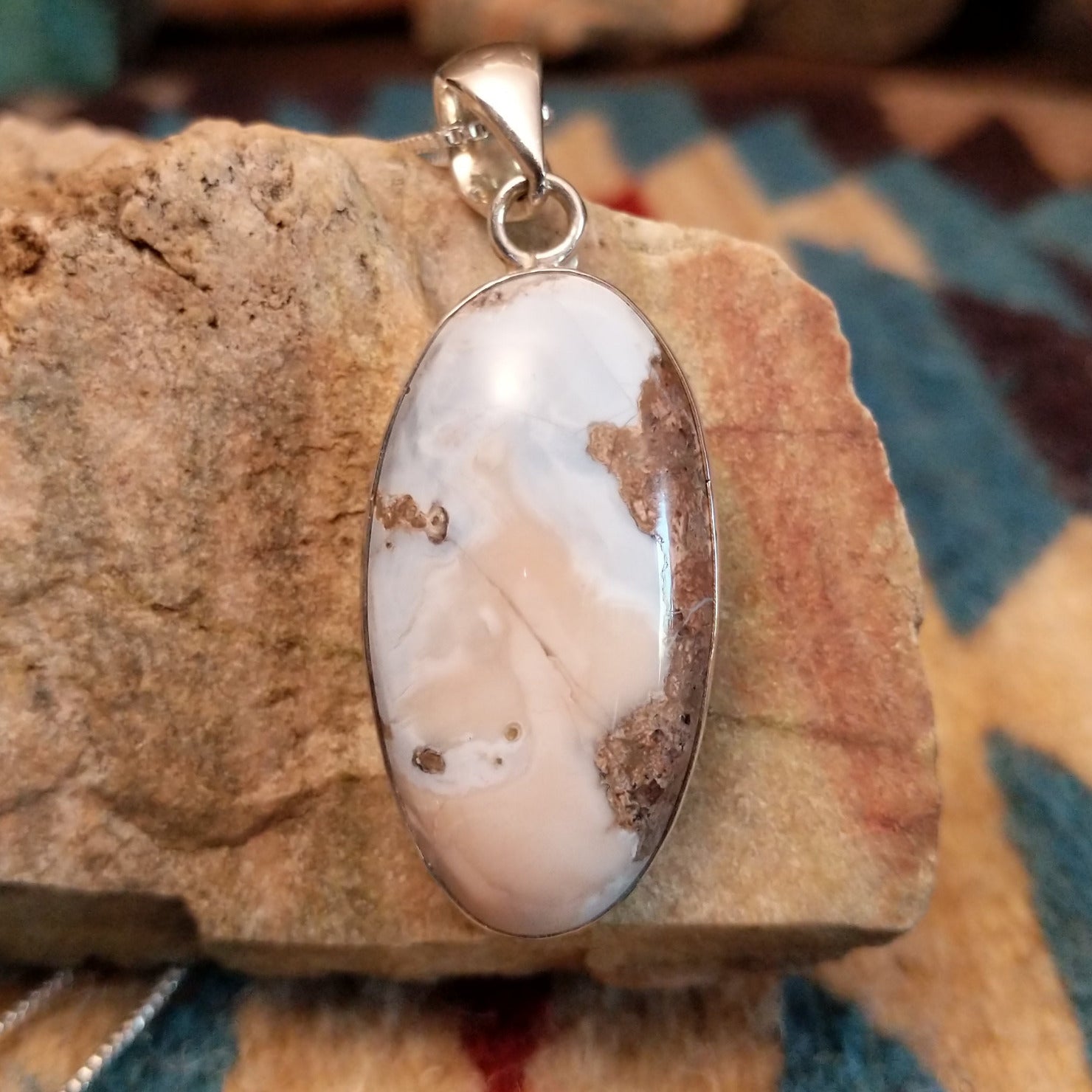 Sterling silver pendant with Arizona blue opal set in the oval bezel.