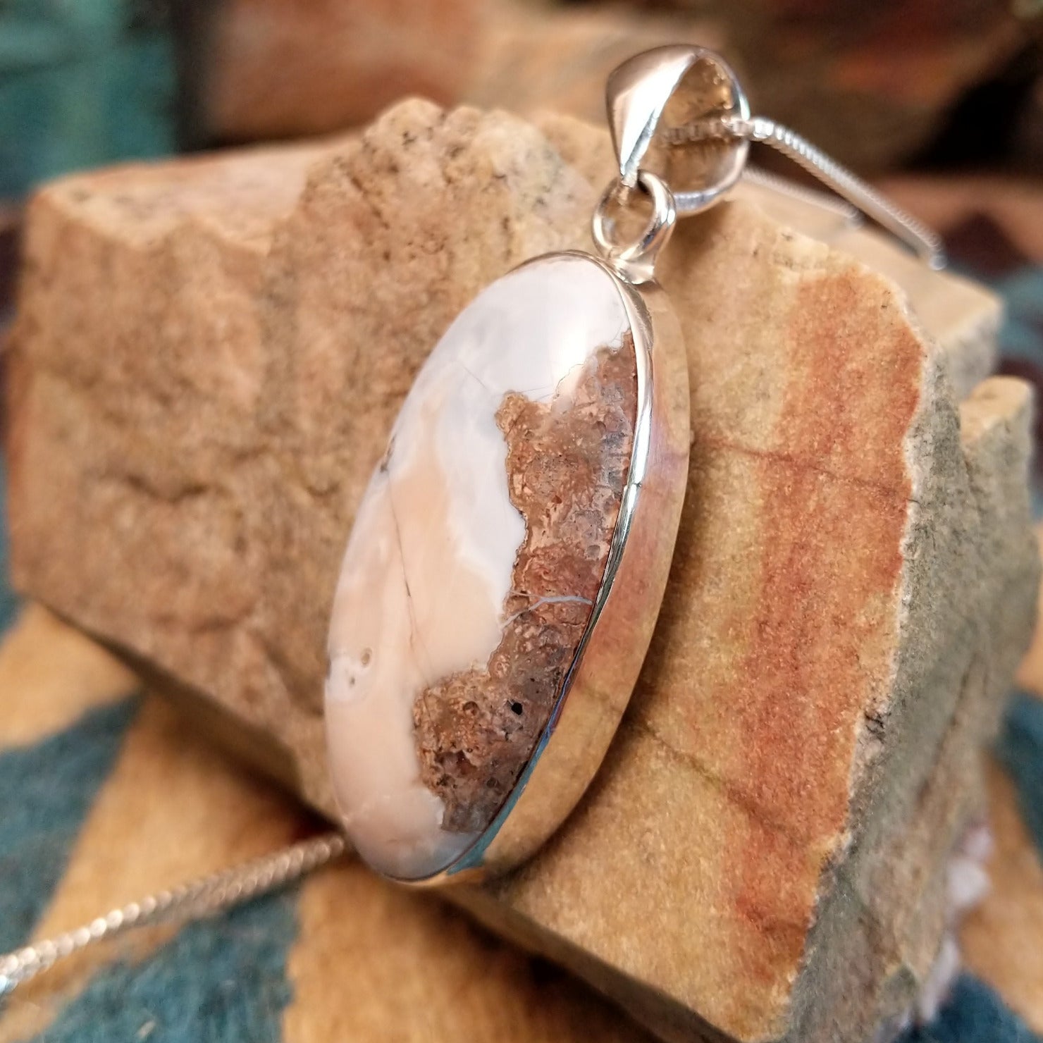 Sterling silver pendant with Arizona blue opal set in the oval bezel.