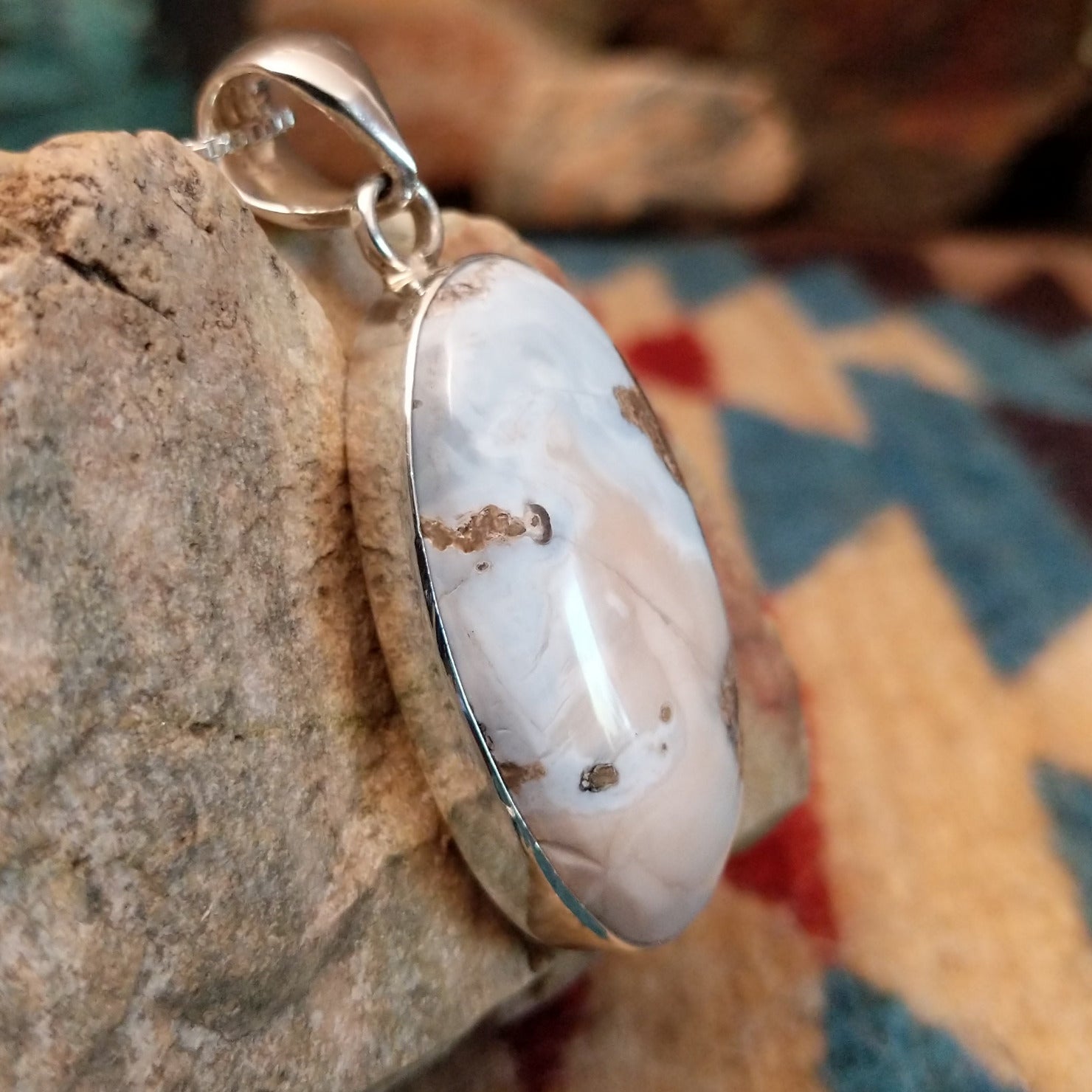 Sterling silver pendant with Arizona blue opal set in the oval bezel.