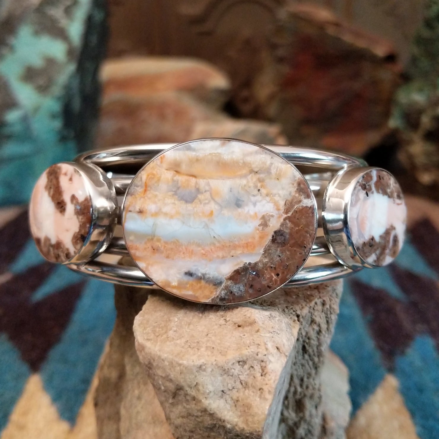 Sterling silver cuff bracelet with Arizona blue opal set in large, oval bezels.