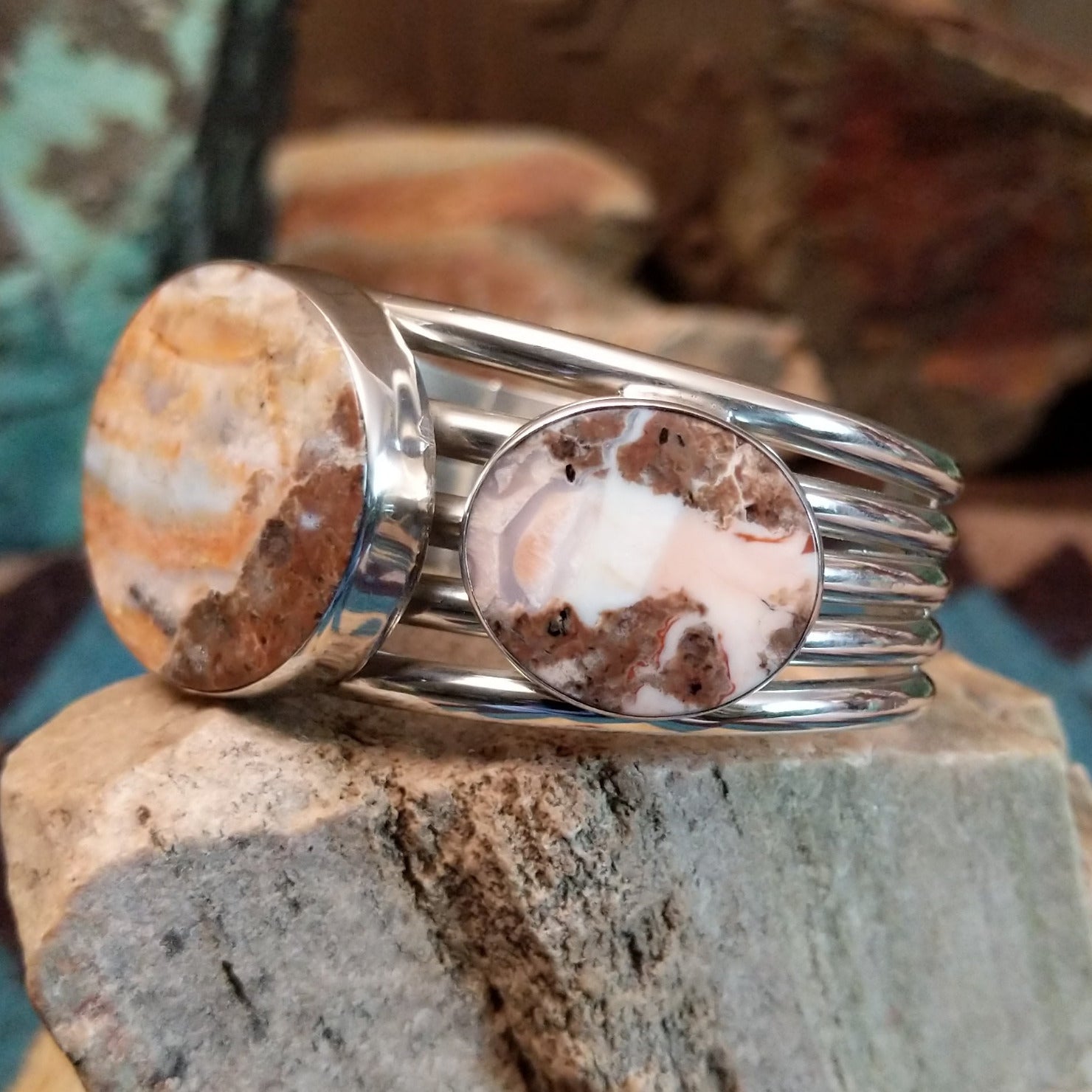 Sterling silver cuff bracelet with Arizona blue opal set in large, oval bezels.