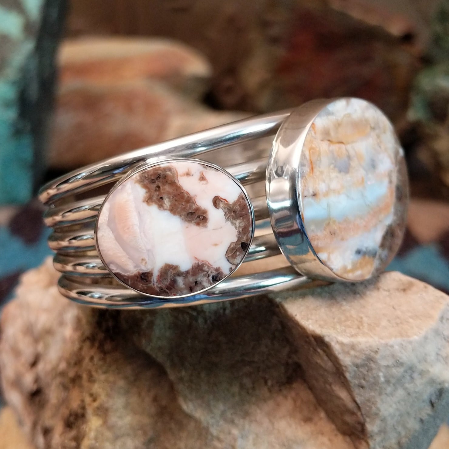 Sterling silver cuff bracelet with Arizona blue opal set in large, oval bezels.