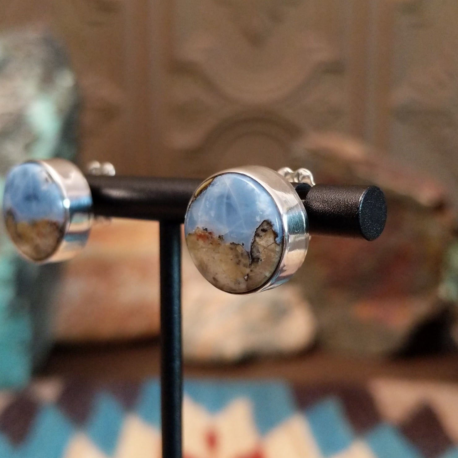 Sterling silver post earrings with Arizona blue opal set in round bezels.