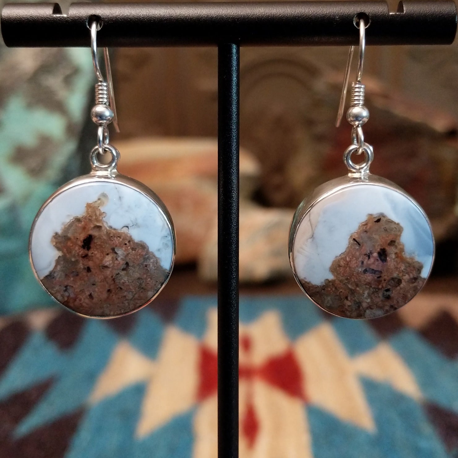 Sterling silver dangle earrings with Arizona blue opal set in round bezels.