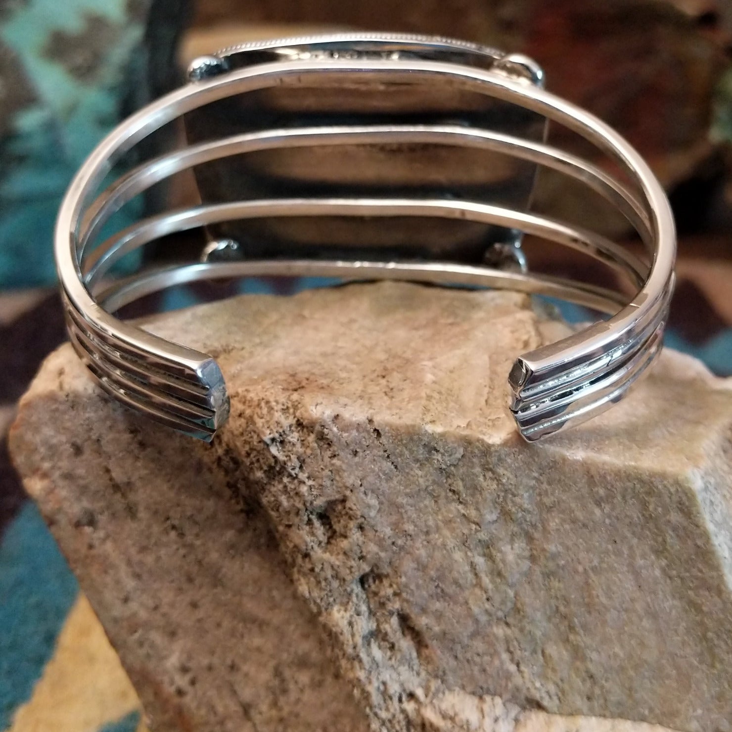 Sterling silver cuff bracelet with Arizona blue opal set in the large bezel, framed by ribbed silverwork.