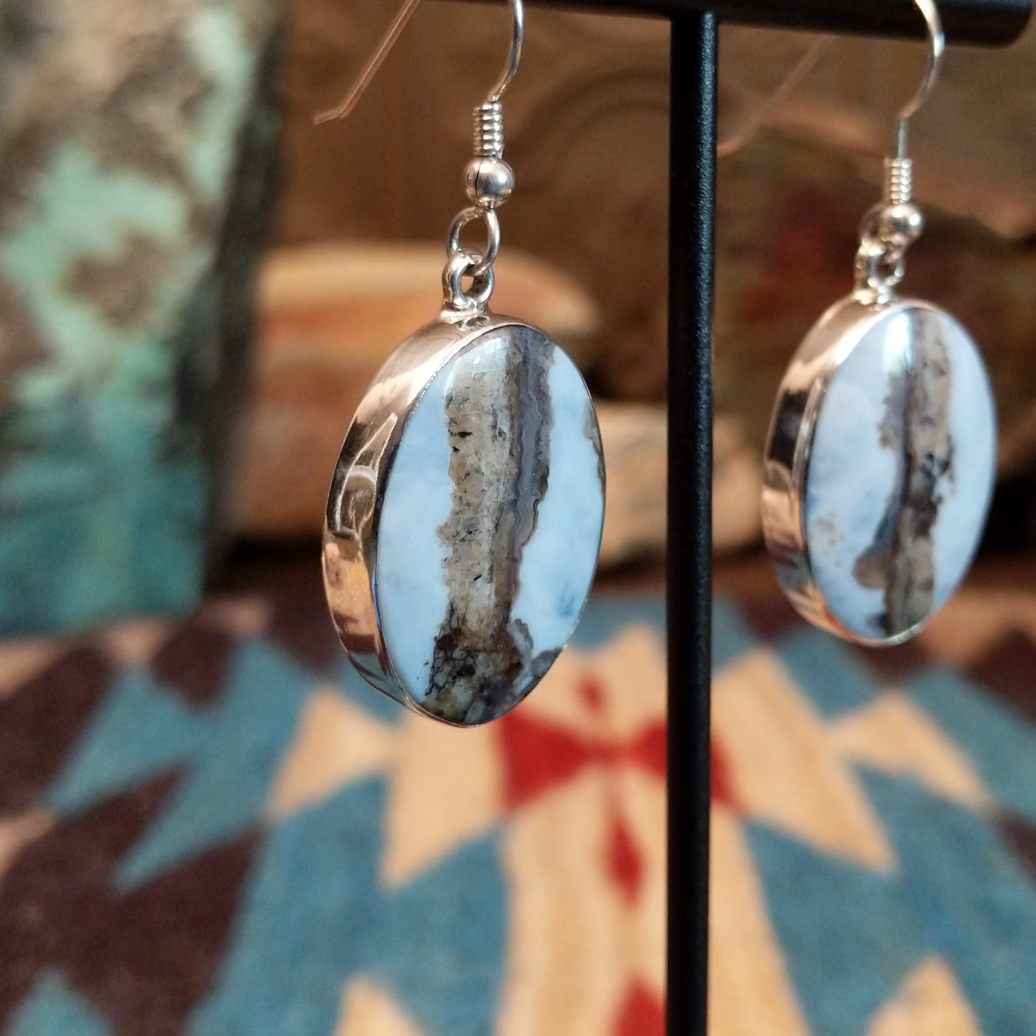 Sterling silver dangle earrings with Arizona blue opal set in oval bezels.