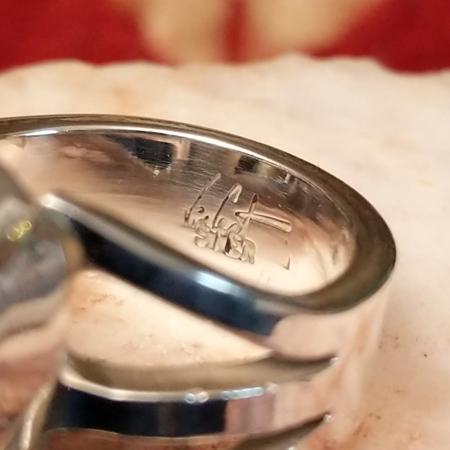 Close-up of the artisan's stamped signature.