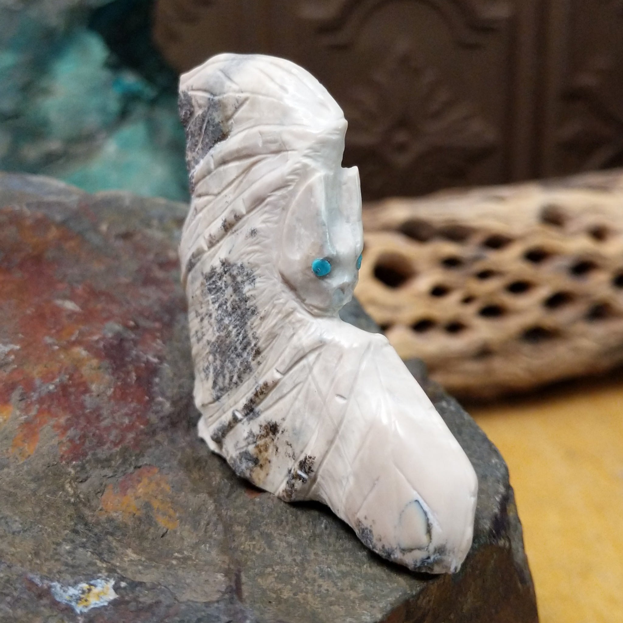 Bat Zuni fetish carving by Derrick Kaamasee with engraved wings, natural gray matrix, and turquoise inlaid eyes.