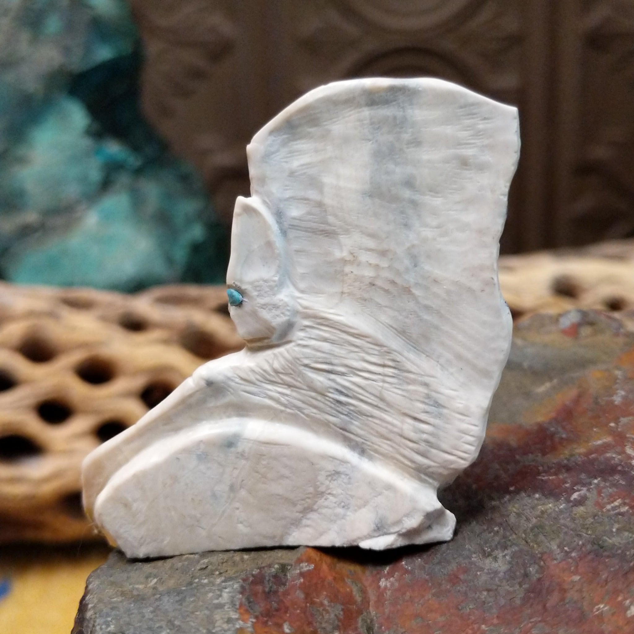 Bat Zuni fetish carving by Derrick Kaamasee with engraved wings, natural gray matrix, and turquoise inlaid eyes.