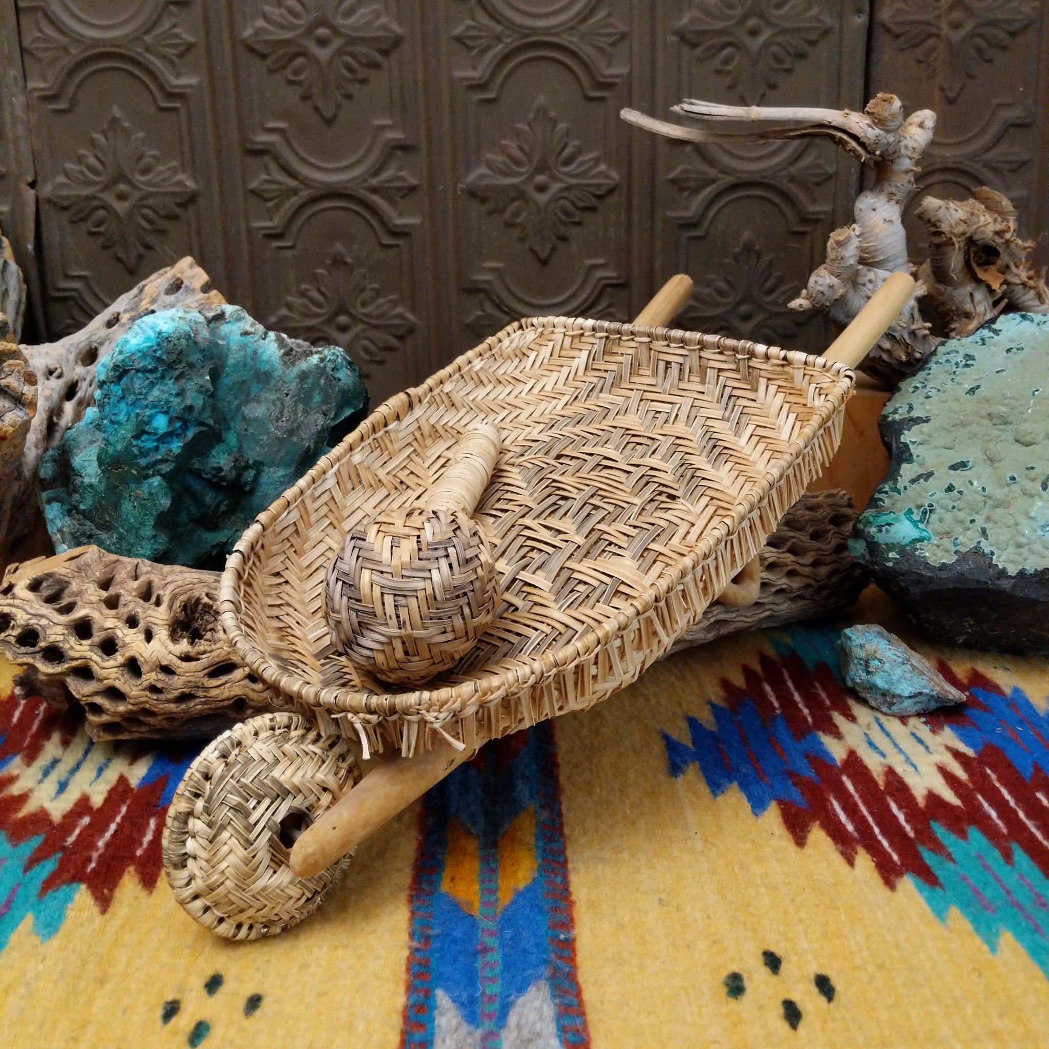 Hopi handwoven wheelbarrow basket rattle by Robelita Martin with a woven basket, wheel, and removable woven rattle.