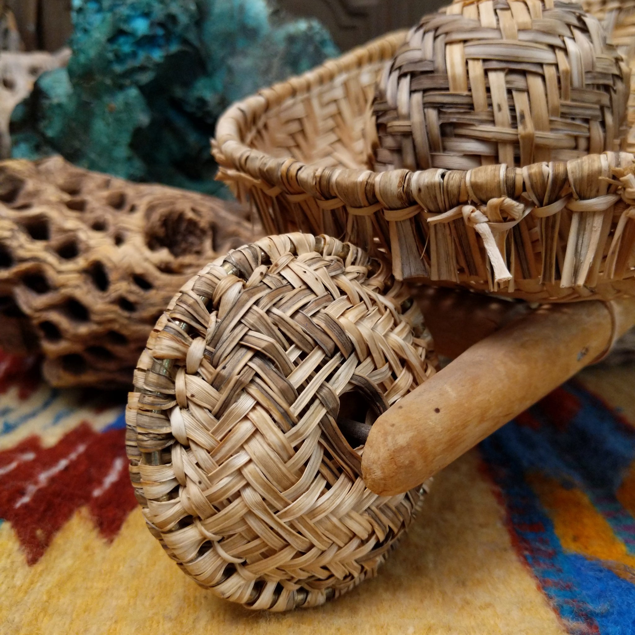 Hopi handwoven wheelbarrow basket rattle by Robelita Martin with a woven basket, wheel, and removable woven rattle.