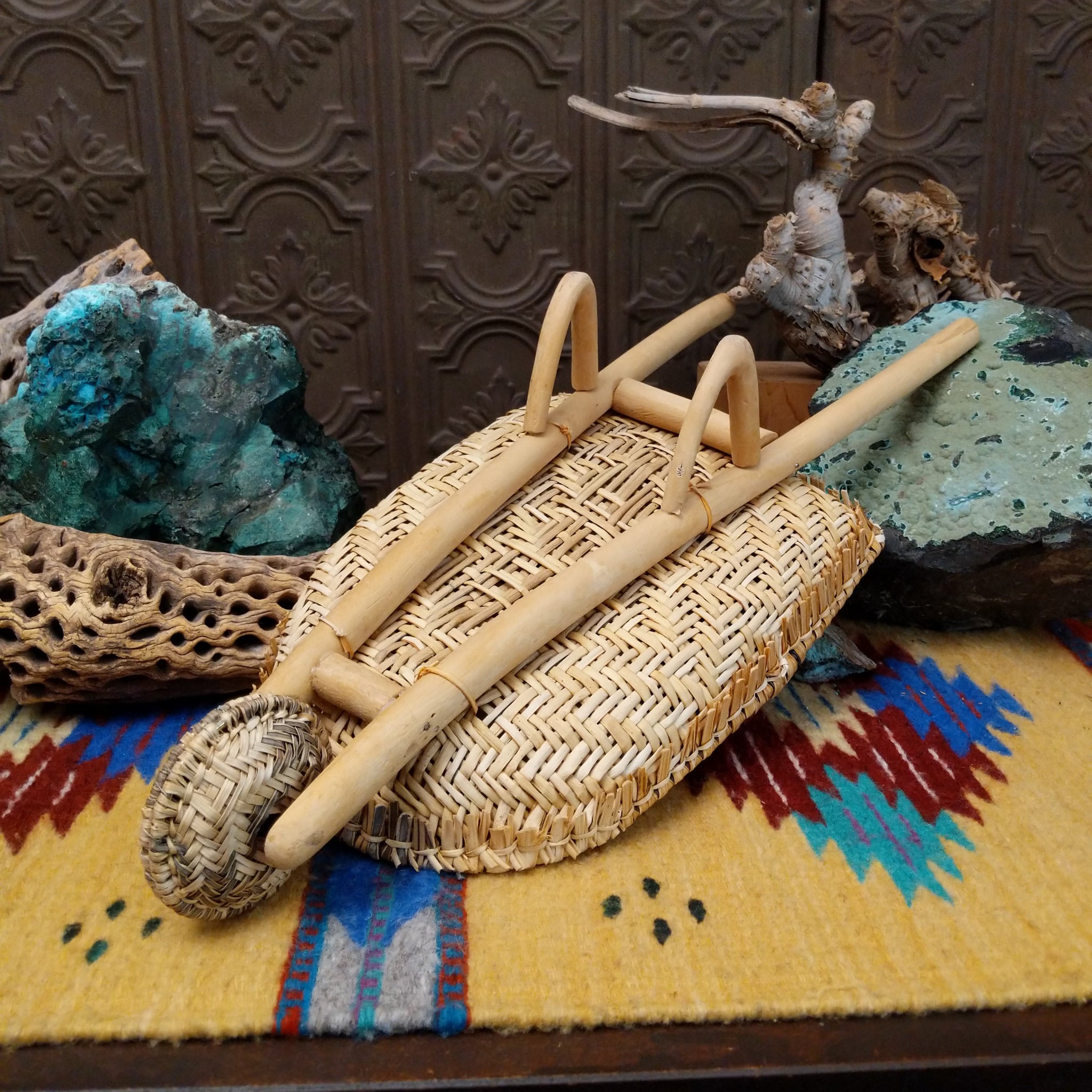 Hopi handwoven wheelbarrow basket rattle by Robelita Martin with a woven basket, wheel, and removable woven rattle.