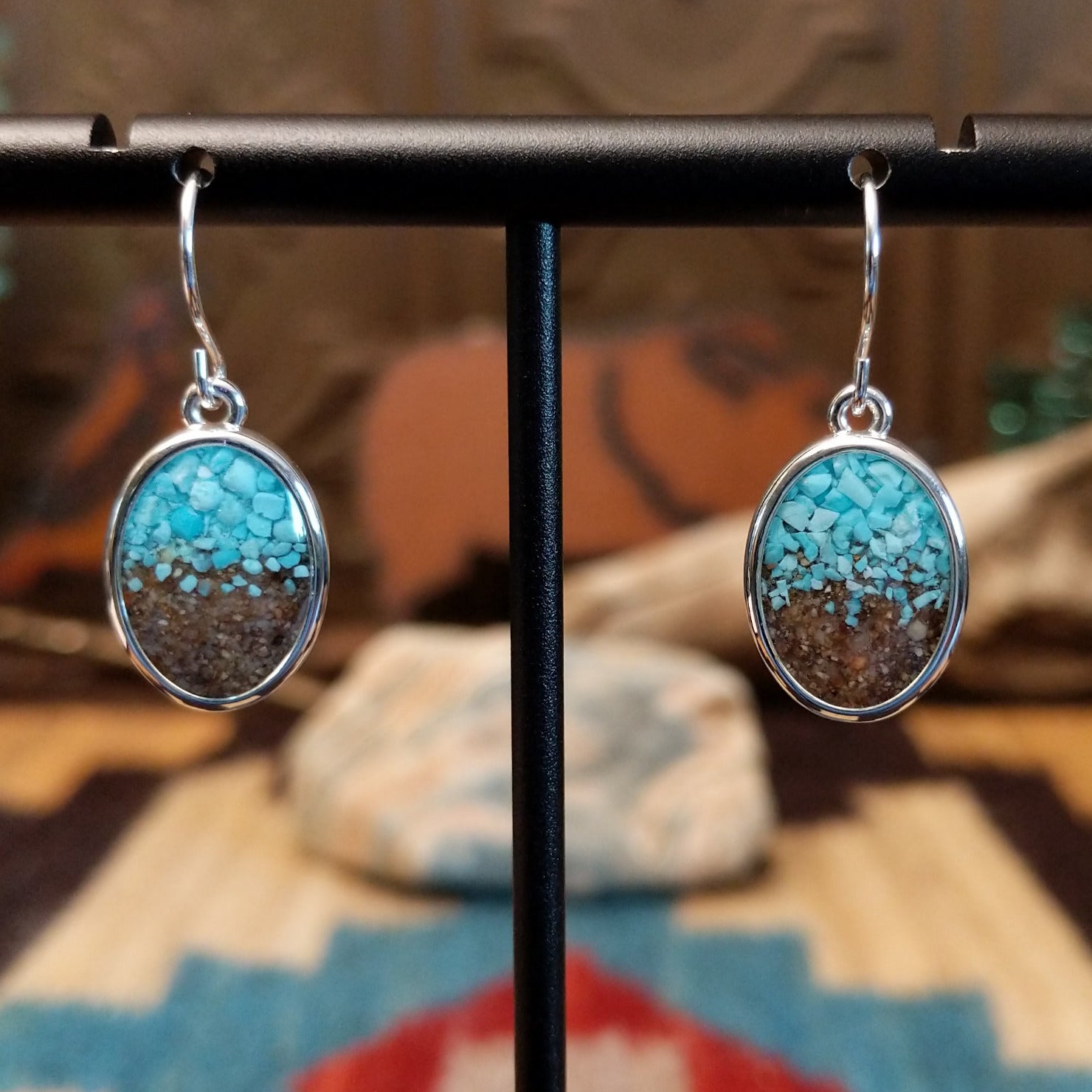 Silver-plated brass dangle earrings with turquoise and San Pedro River sand set in oval bezels.