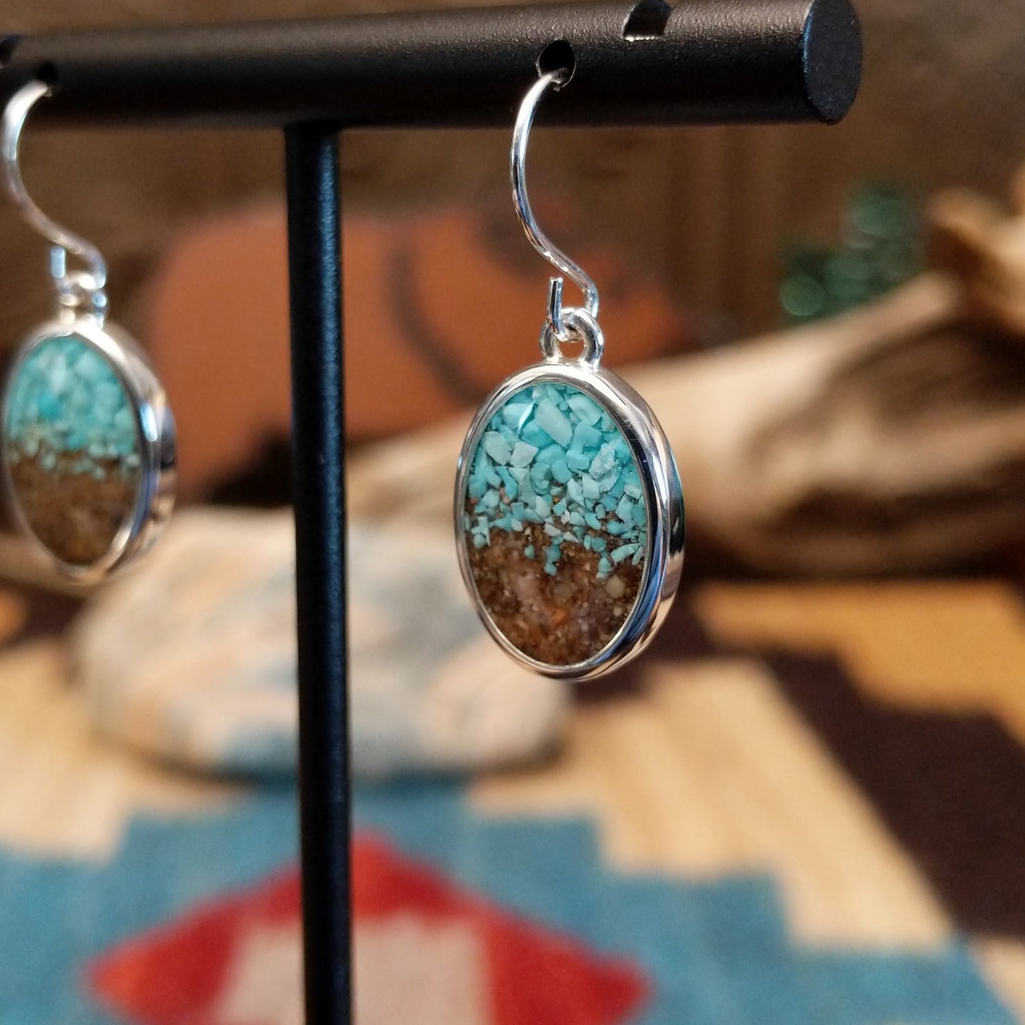 Silver-plated brass dangle earrings with turquoise and San Pedro River sand set in oval bezels.