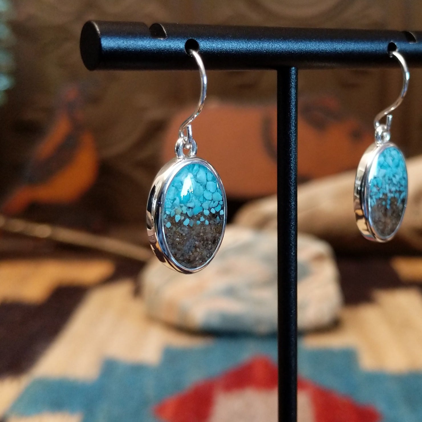 Silver-plated brass dangle earrings with turquoise and San Pedro River sand set in oval bezels.