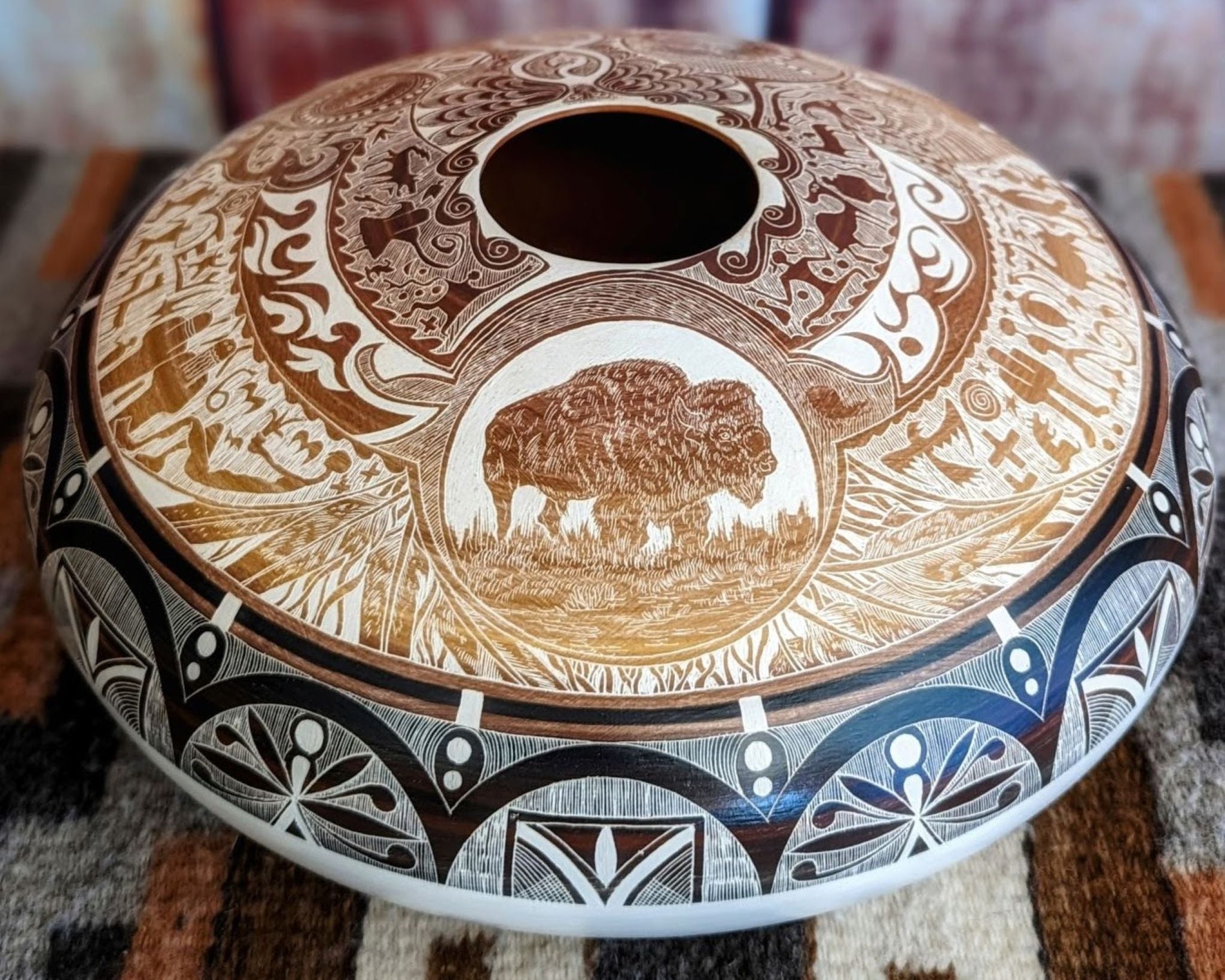 Etched Bison pottery piece by Ute Mountain Tribe artist, Norman Lansing.